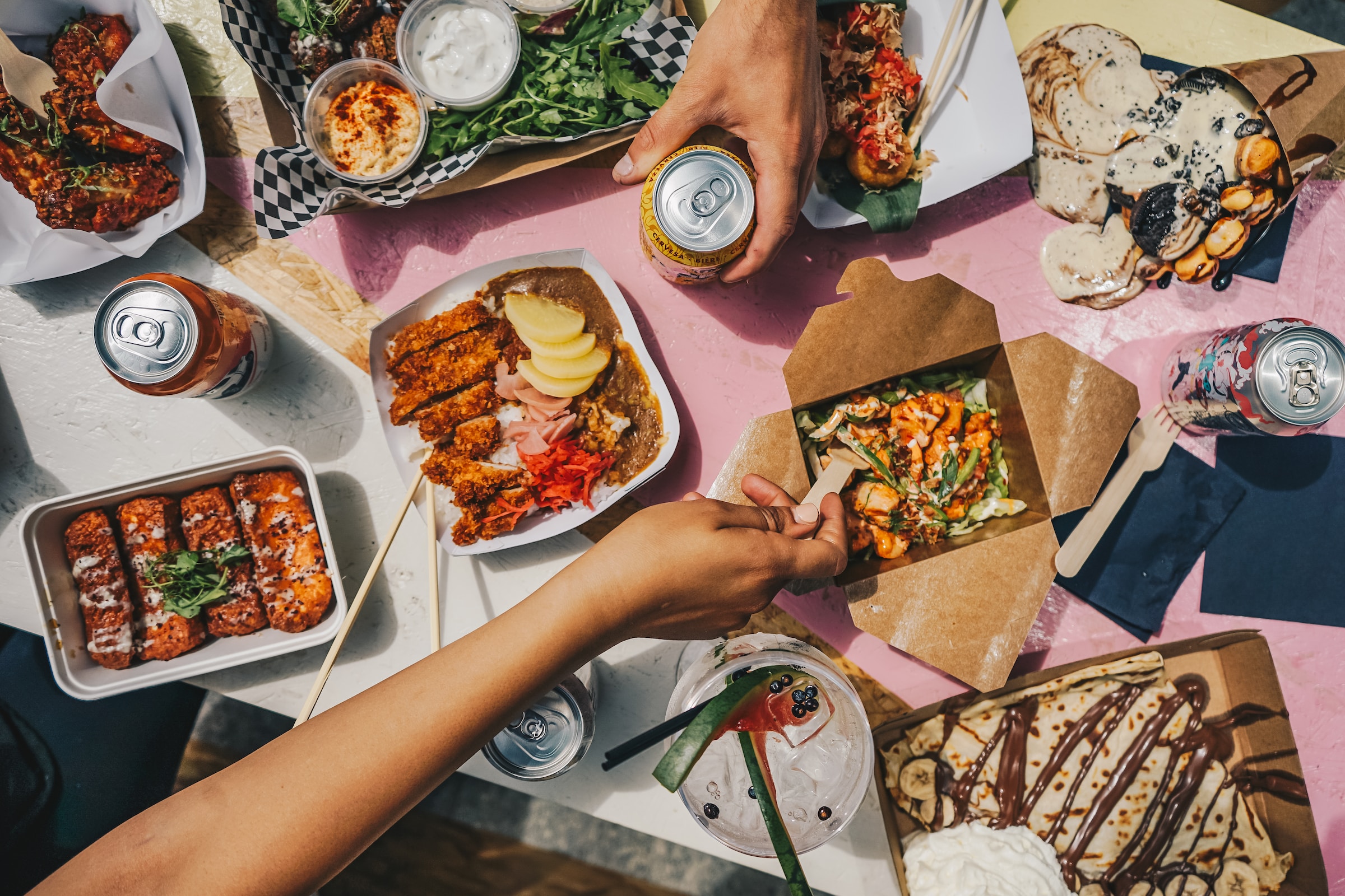 people sitting around a table eating food