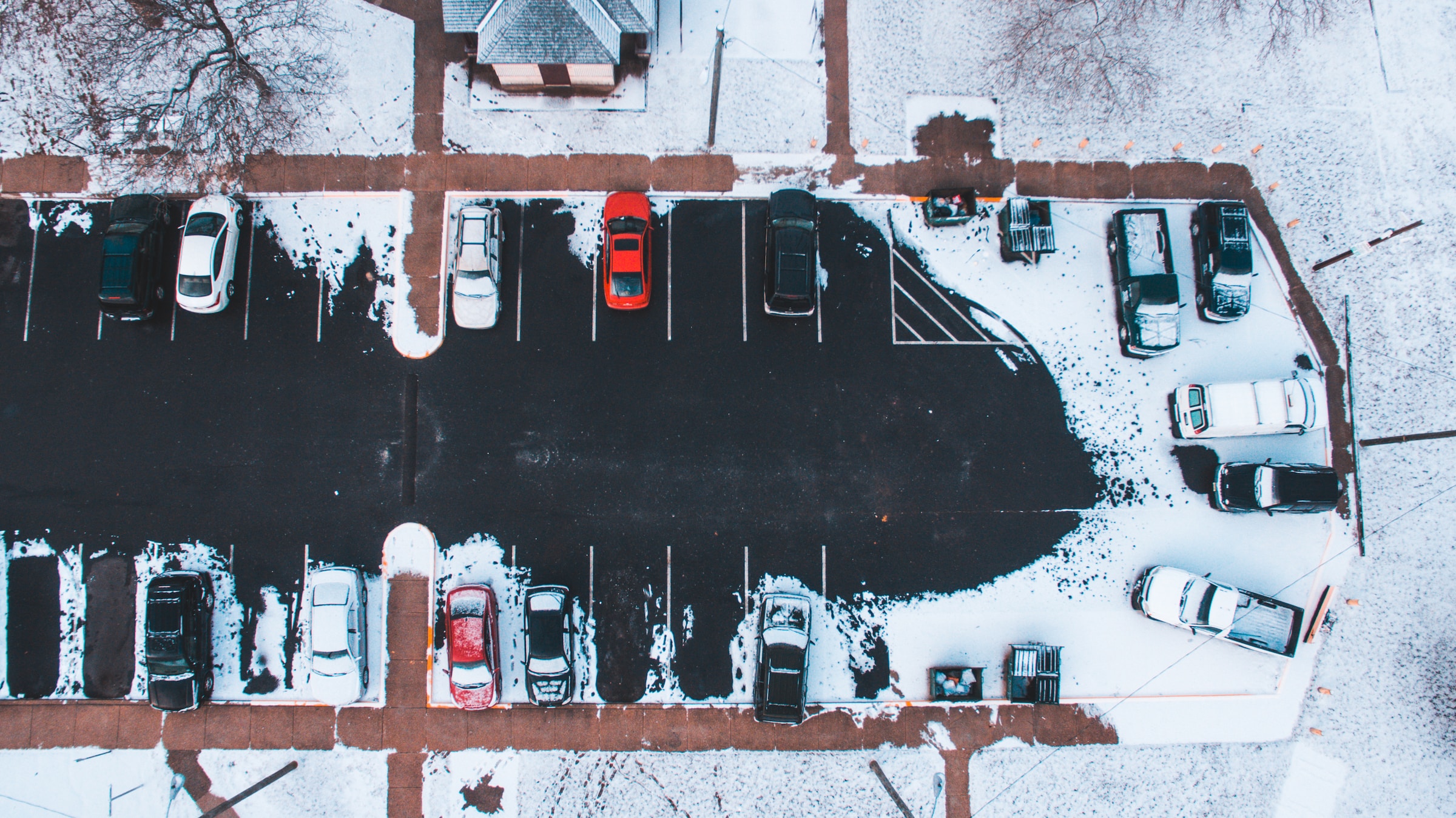 Cars parked in snowy car park
