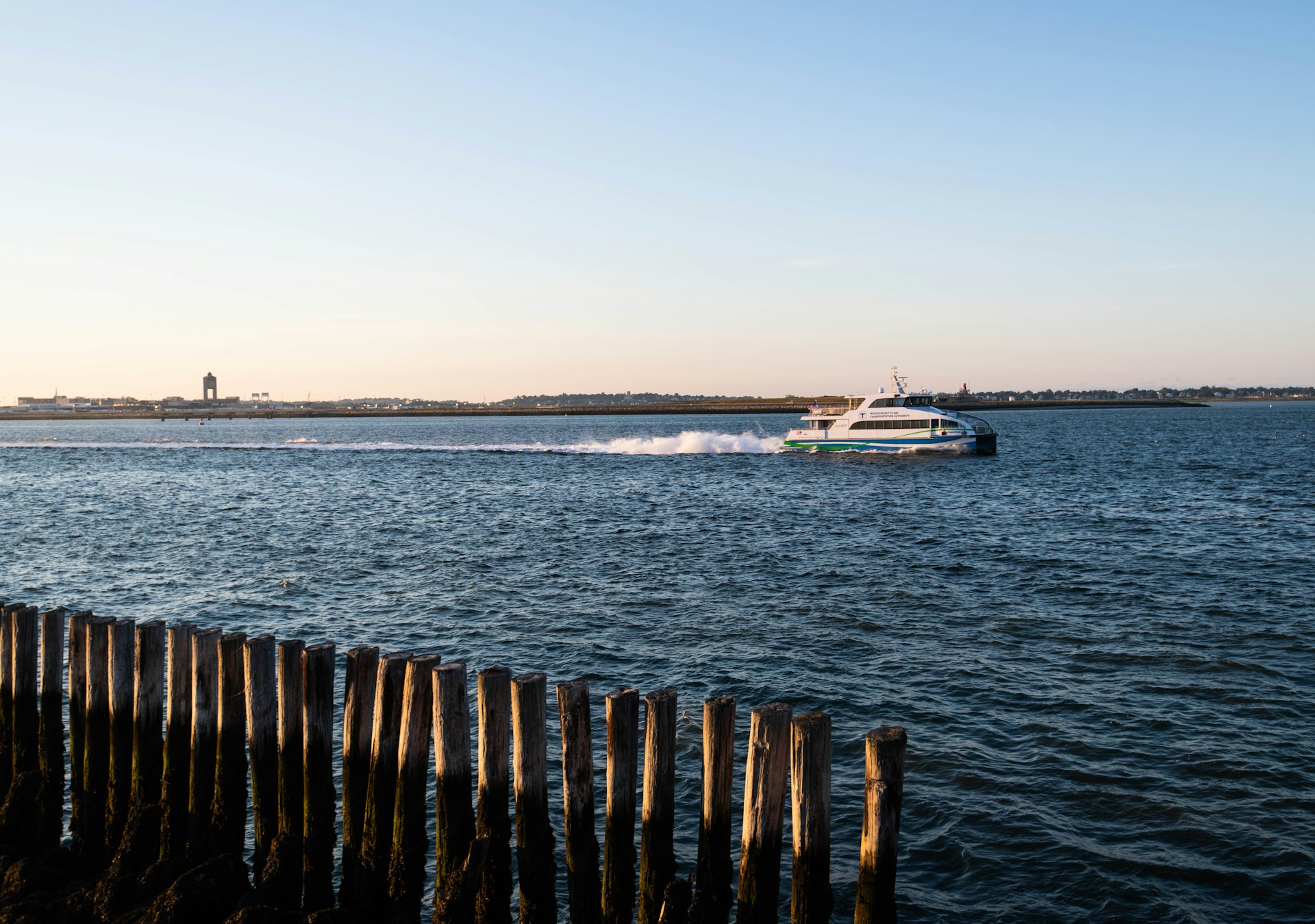 Boat in the Boston Harbor jetting by