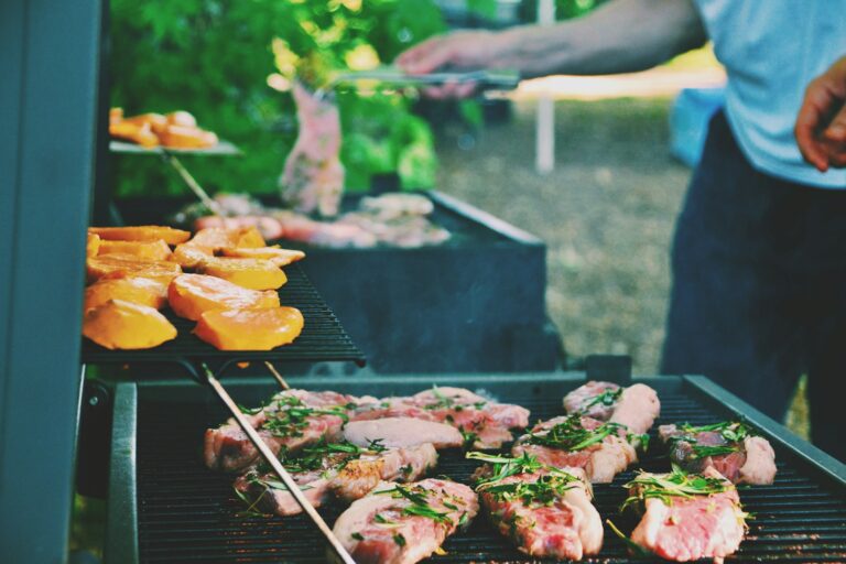 people cooking food on the barbecue