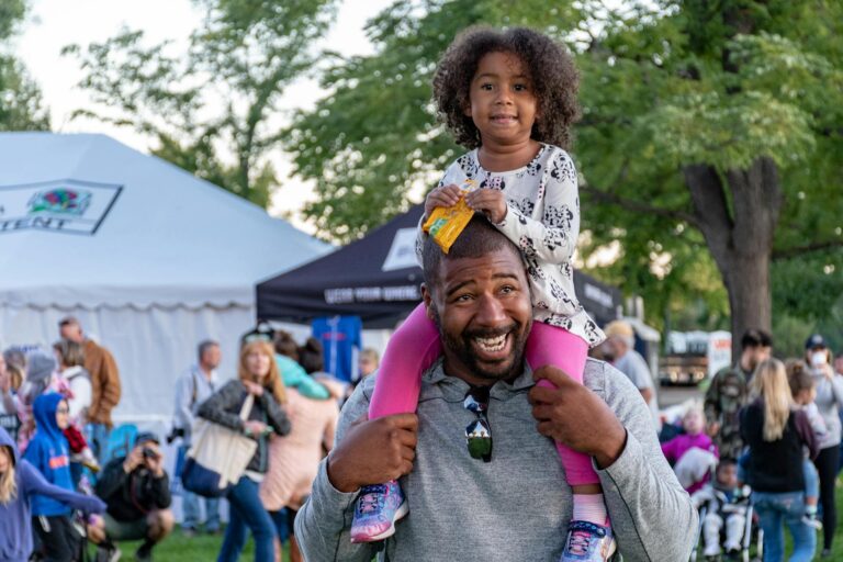 father and daughter enjoying a festival